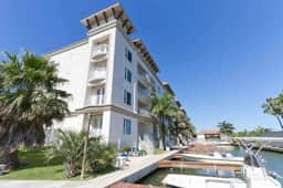 Channel Front Condo with Boat Slip & Infinity Pool