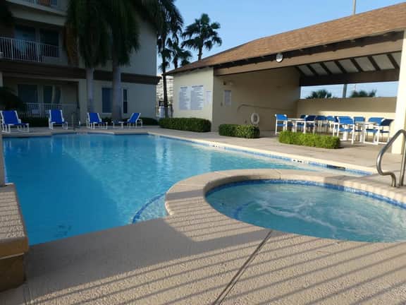Channel Front Condo with Boat Slip & Infinity Pool