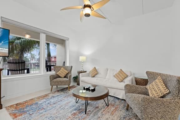 Channel Front Condo with Boat Slip & Infinity Pool