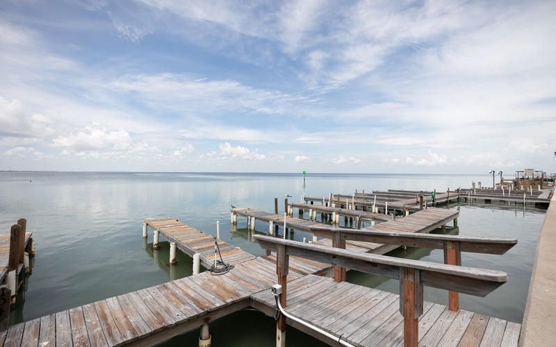 A wooden dock in the middle of a body of water