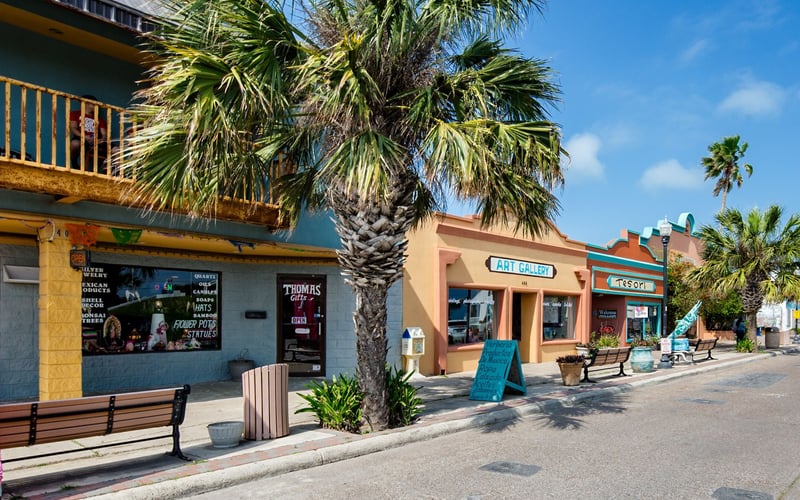 A row of colorful buildings on a sunny day